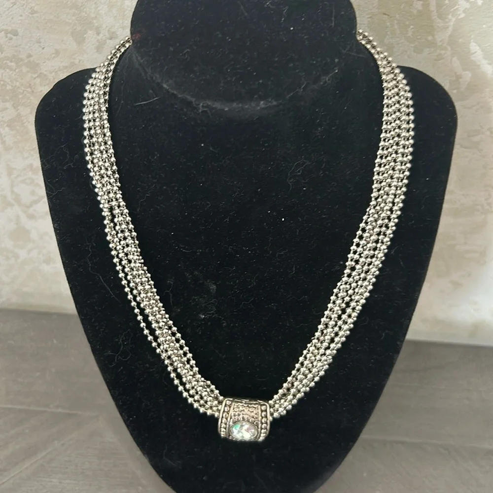 Gorgeous silver strand necklace with crystal slide